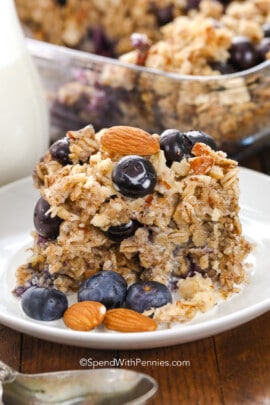 blueberry baked oatmeal on a plate with almonds