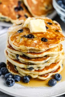 plated Blueberry Pancakes with butter and syrup