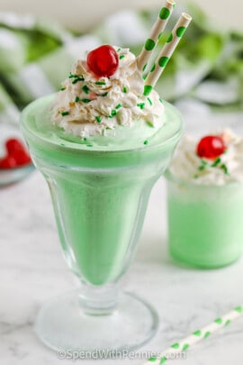 Copycat Shamrock Shakes in glasses with whipped cream and cherries