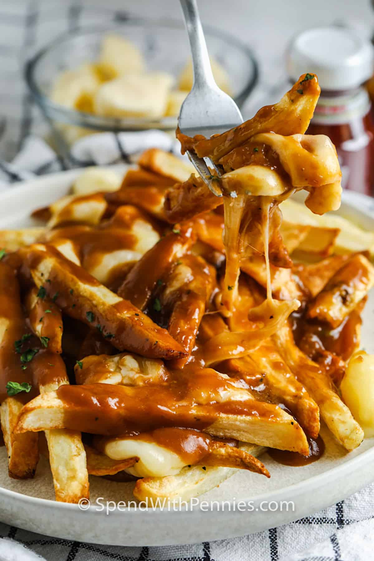 taking a fork full of Homemade Poutine