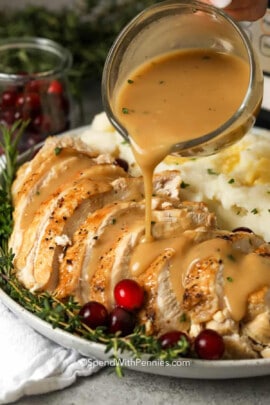 pouring gravy over Instant Pot Turkey Breast