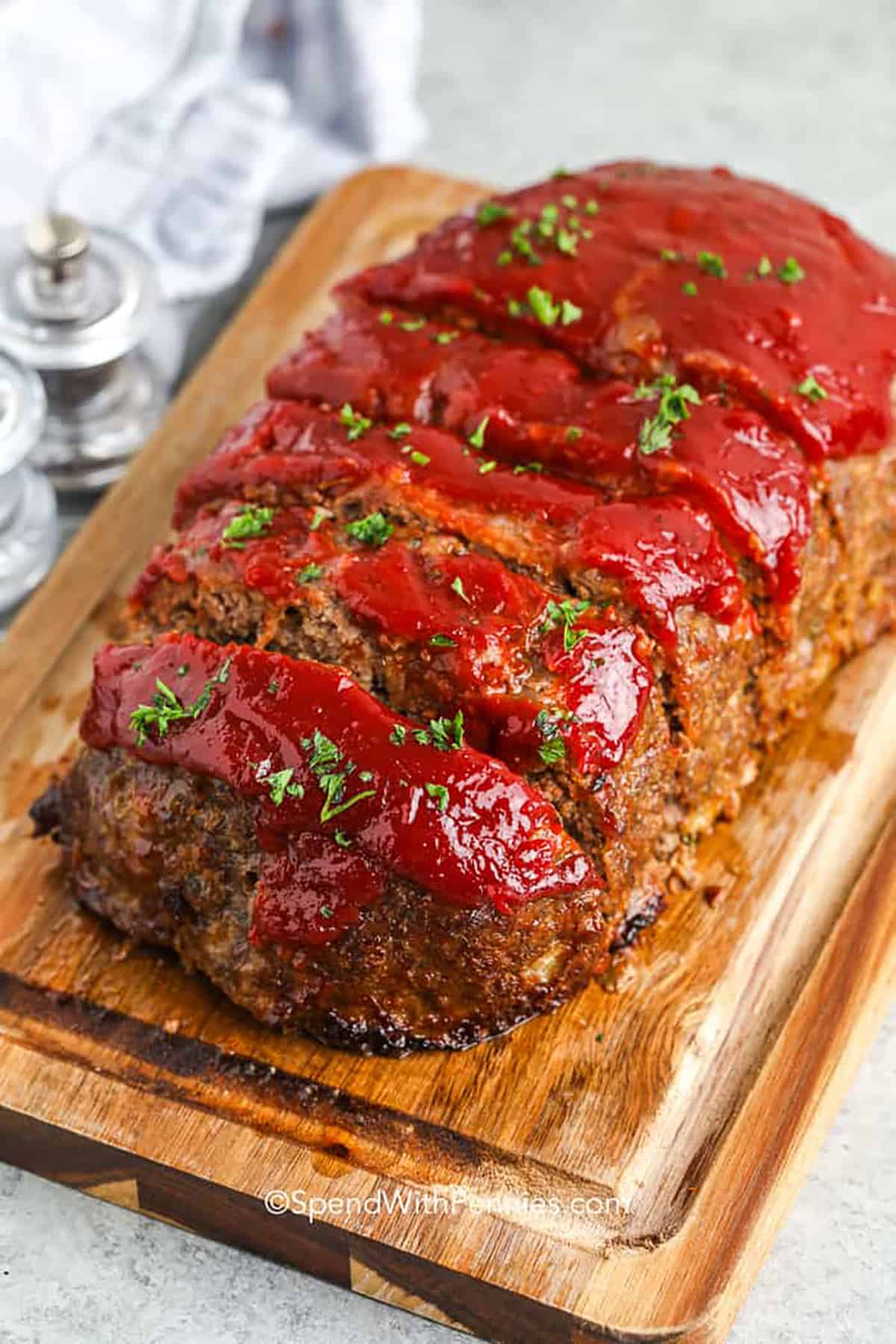 The Best Meatloaf Recipe sliced on a cutting board