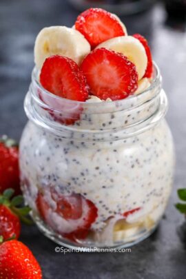 a jar of overnight oats with bananas and strawberries