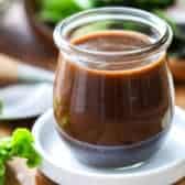 Balsamic Vinaigrette in a jar on a white plate