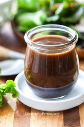 Balsamic Vinaigrette in a jar on a white plate