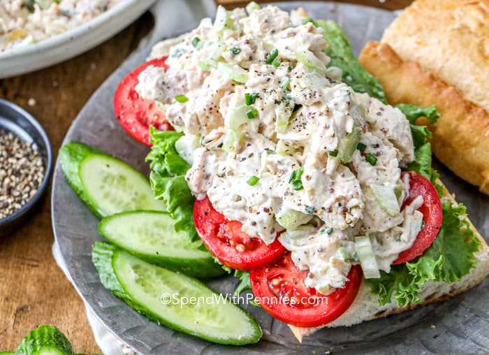 Classic Chicken Salad on a long roll with greens and tomatoes