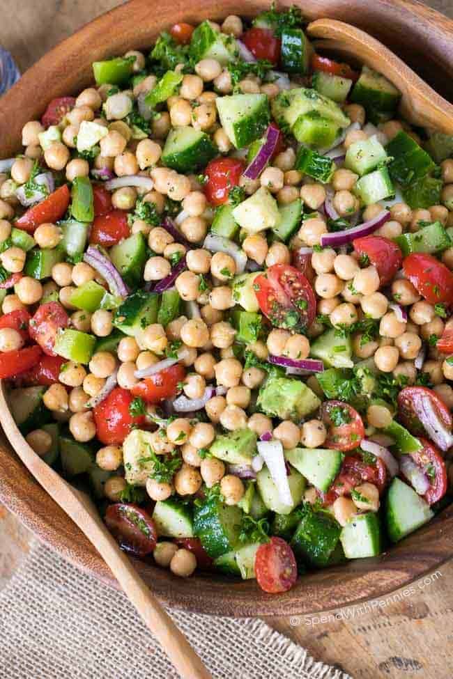 Chickpea Salad in a wooden bowl with spoons