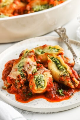 Classic Stuffed Shells Recipe on a plate with a fork