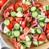 Overhead picture of Cucumber Tomato Salad in a wooden bowl