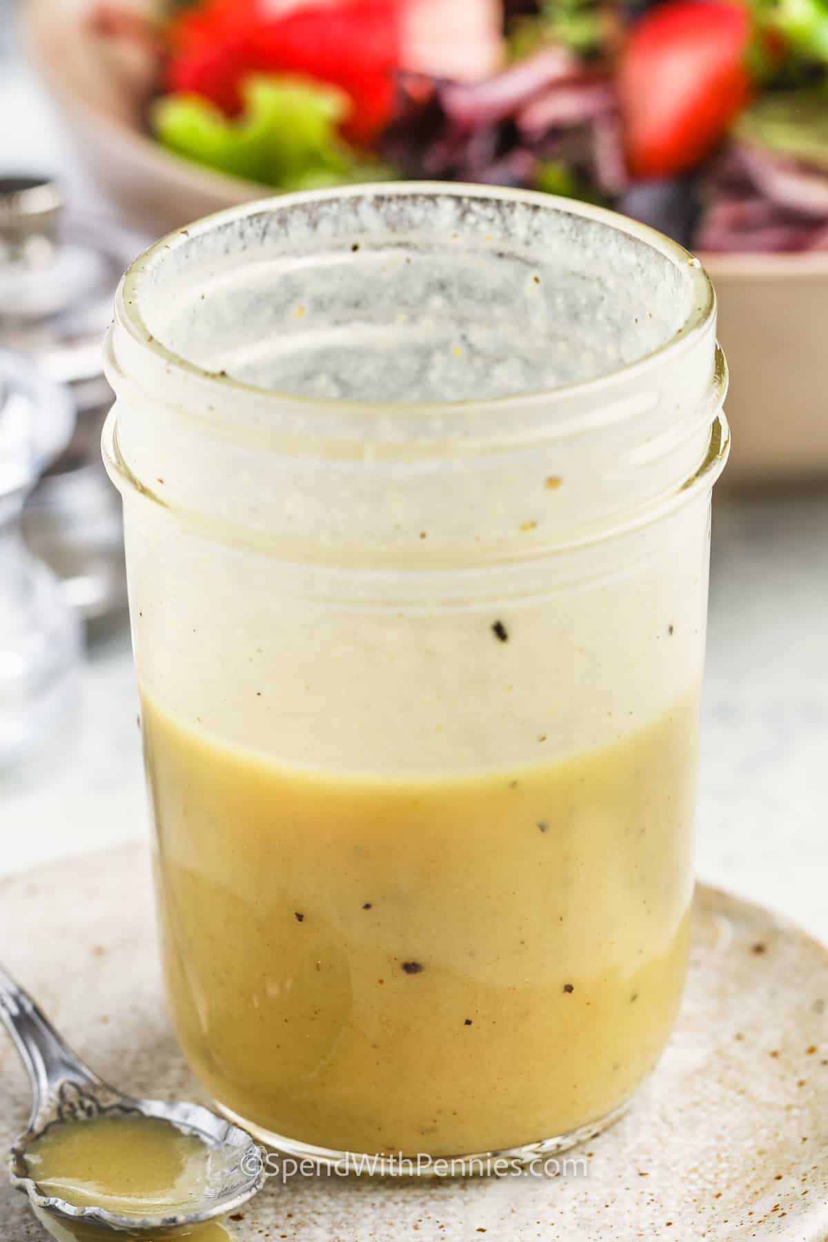 salad in a bowl and jar of Easy Dijon Vinaigrette