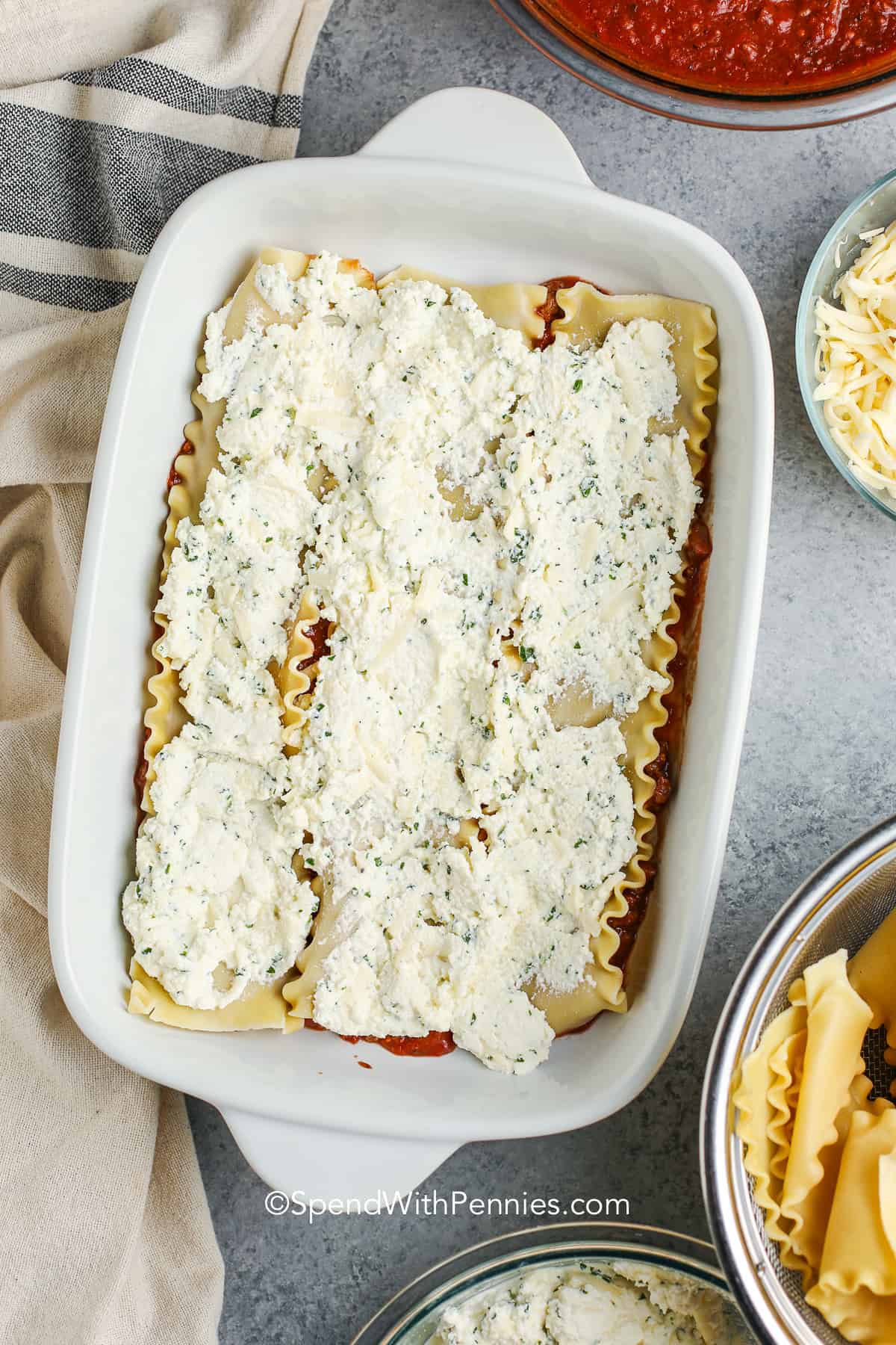 lasagna noodles with ricotta cheese in a baking dish
