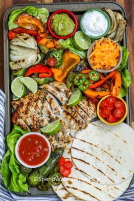 Baking sheet with ingredients for grilled chicken fajitas