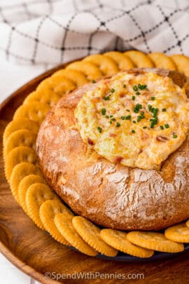 Mississippi Sin Dip in a bread bowl plated with crackers