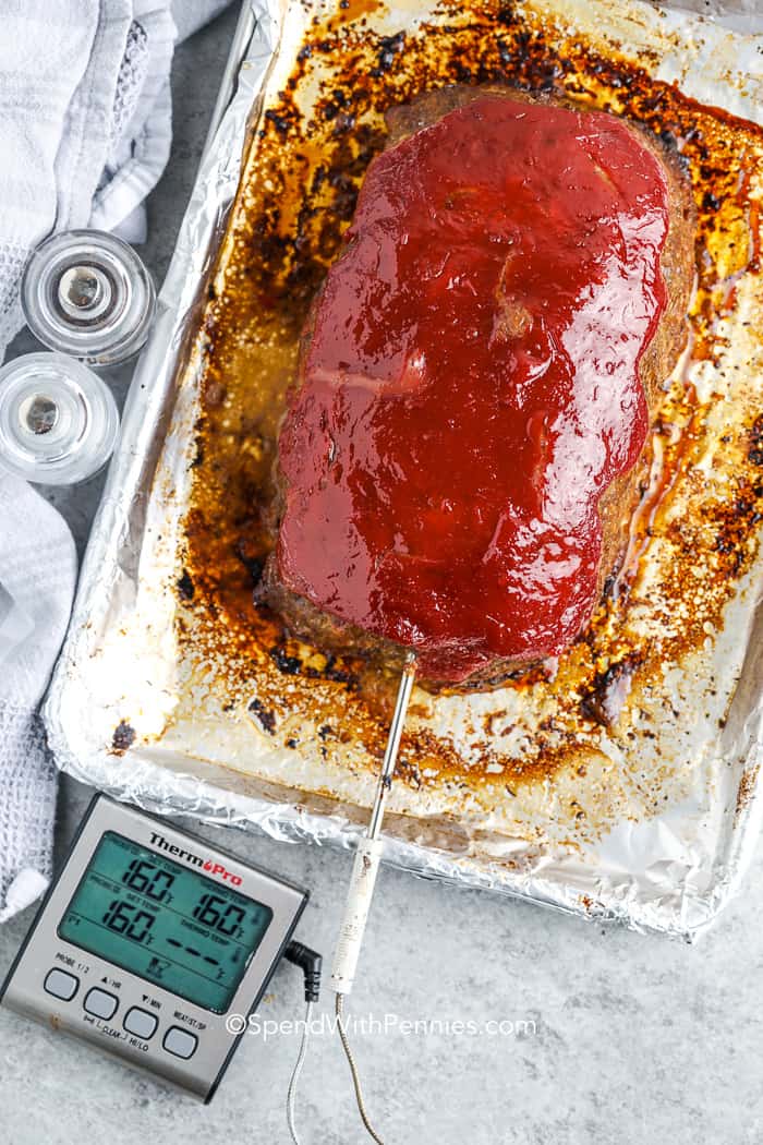 cooked meatloaf on a baking pan
