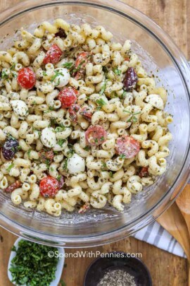 pesto pasta salad in a bowl with parsley