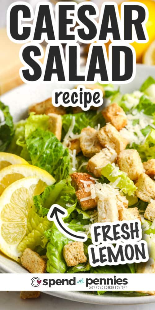 close up of Grilled Chicken Caesar Salad with lemon slices and writing