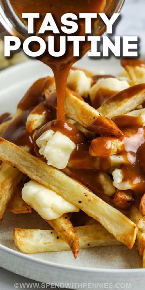 pouring gravy over fries and cheese curds to make Homemade Poutine with a title