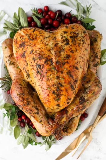 overhead of herb roast turkey on a platter