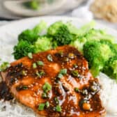 Teriyaki Salmon on a white plate with rice and broccoli