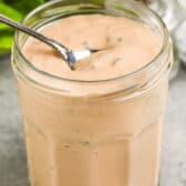 Thousand Island Dressing being scooped out of a jar